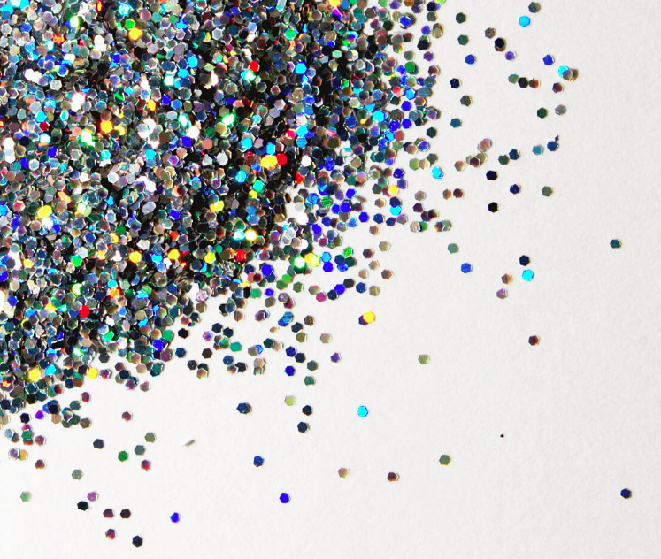 Pile of glitter spread over a white table