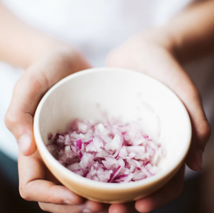 a small bowl of finely chopped red onions